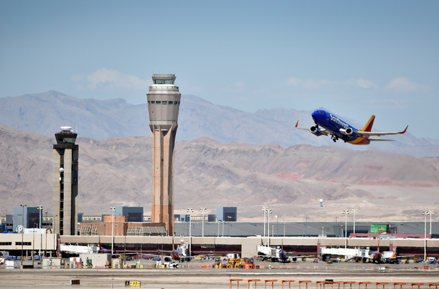 A Southwest Airline passenger jet takes off from McCarran International Airport under the control of the smaller of the two federal air traffic control towers on Monday, June 8, 2015. The new 352- ...