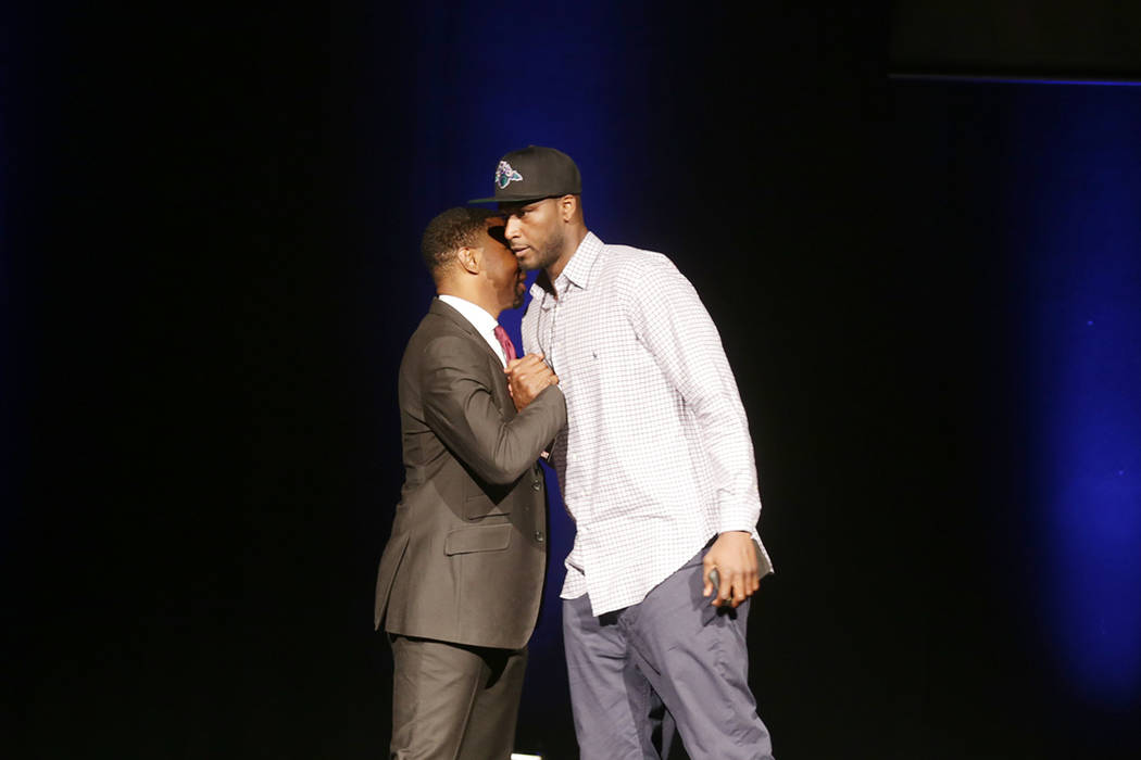 Kwame Brown, right, shakes hands with Roger Mason Jr. after being drafted for the Killer 3s team on Sunday, April 30, 2017, at the BIG3 inaugural draft at Planet Hollywood in Las Vegas. BIG3 is Ic ...