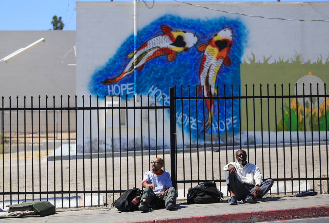 Joseph McCallen, left, and Ricky Triplett sit on Foremaster Lane in Las Vegas, on Friday, April 28, 2017, in front of land that the city of Las Vegas wants to turn into a campus that will bring ho ...