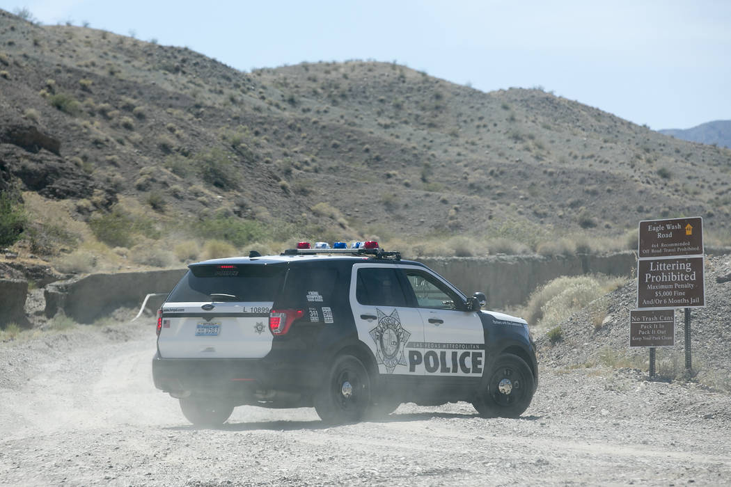 Metro officers block an entrance to Eagle Wash Road, that leads to the crime scene, at Lake Mead National Recreation Area on Tuesday, May 2, 2017. Bridget Bennett Las Vegas Review-Journal @bridget ...