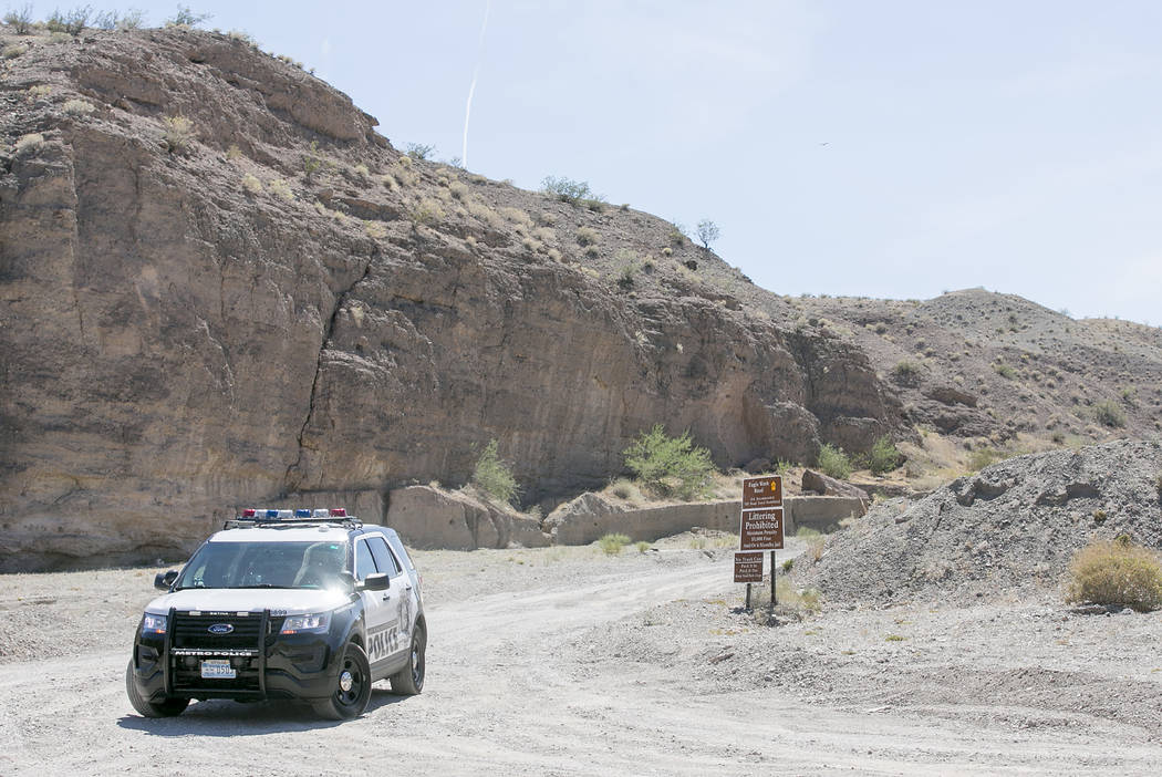 Metro officers block an entrance to Eagle Wash Road, that leads to the crime scene, at Lake Mead National Recreation Area on Tuesday, May 2, 2017. Bridget Bennett Las Vegas Review-Journal @bridget ...