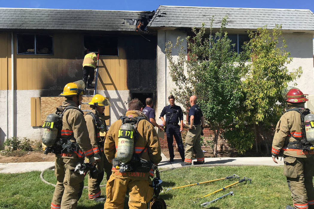 Clark County firefighters respond to a blaze at 741 and 743 Greenbriar Townhouse Way in Las Vegas on Wednesday, May 3, 2017. Bizuayehu Tesfaye/Las Vegas Review-Journal @bizutesfaye