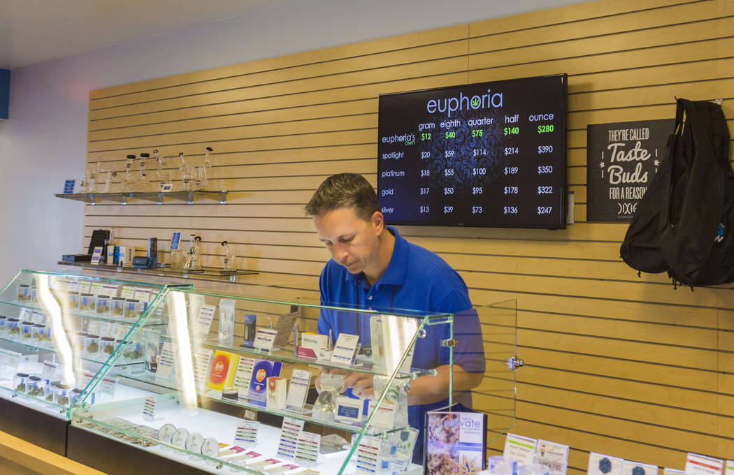 Bud tender Jayson Stutsman works at Euphoria Wellness, a medical marijuana dispensary located in West Las Vegas, Thursday, April 13, 2017. Elizabeth Brumley Las Vegas Review-Journal @EliPagePhoto