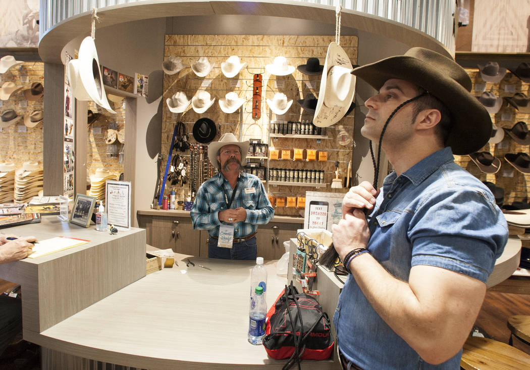 Athanasios Zervas tries on his new hat as Michael Hull looks on at Boot Barn store on Thursday, May 4, 2017, in Las Vegas. Bizuayehu Tesfaye Las Vegas Review-Journal @bizutesfaye