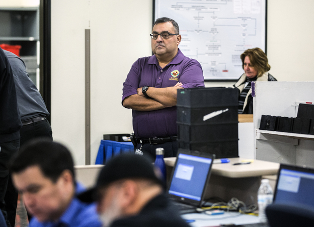 County Registrar of Voters Joe Gloria monitors activity  during a voter recount at the Clark County Election Department office, 965 Trade Drive in North Las Vegas, on Monday, Dec. 7, 2016. The rec ...