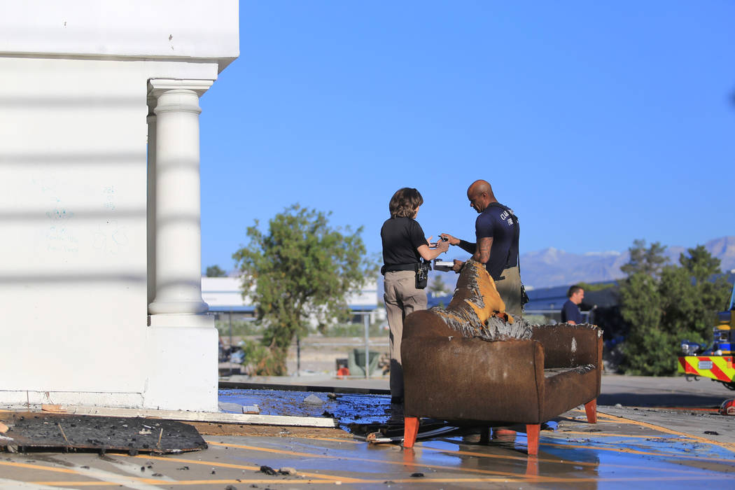 Clark County firefighters clean up the scene of a two-alarm fire at 5285 Dean Martin Drive on Thursday, May 4, 2017, in Las Vegas. Brett Le Blanc Las Vegas Review-Journal @bleblancphoto