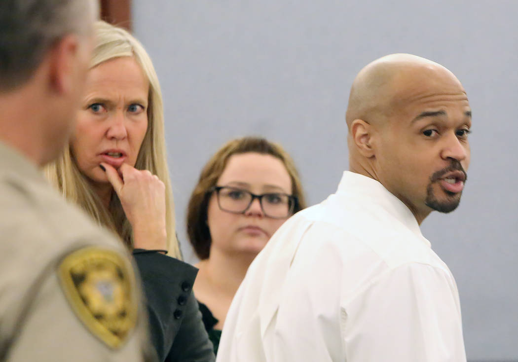 Shaun Leflore appears in court with his attorney Nancy Lemcke, left, at the Regional Justice Center on Friday, May 5, 2017, in Las Vegas. Leflore is charged with first-degree murder in the 2006 de ...