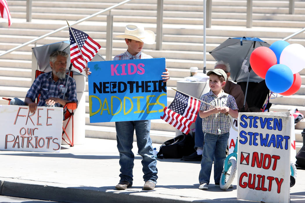 Bronco Bundy, center, 9, and his brother Payton, 5, outside the Lloyd George U.S. Courthouse during closing arguments in the first Bunkerville standoff trial on Wednesday, April 12, 2017, in Las V ...