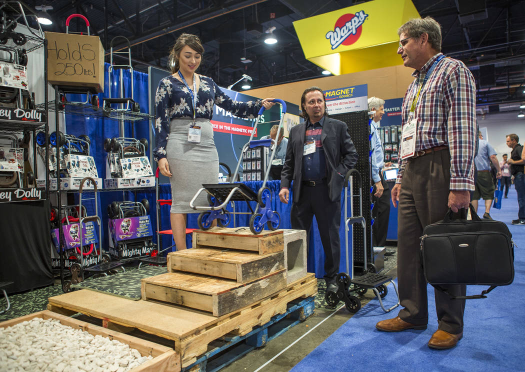 Bob Delain of Pico Rivera, California, right, looks at the Trolley Dolly at National Hardware Show at Las Vegas Convention Center on Wednesday, May 10, 2017. Patrick Connolly Las Vegas Review-Jour ...