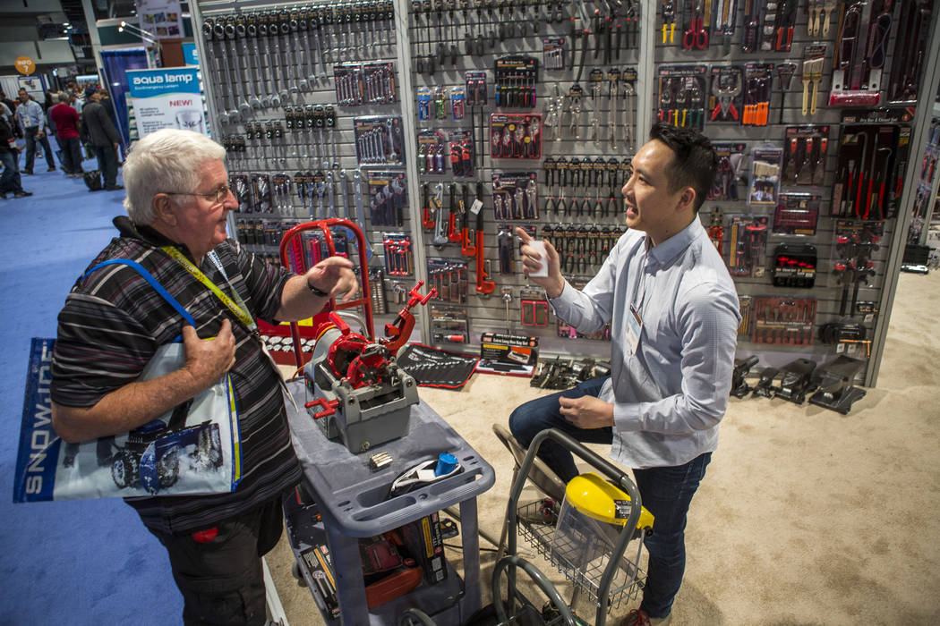 Donnie Tittle, a plumber from Henderson, left, talks with Jeffery Bao of King Tools & Equipment at the National Hardware Show at Las Vegas Convention Center on Wednesday, May 10, 2017. Patrick ...