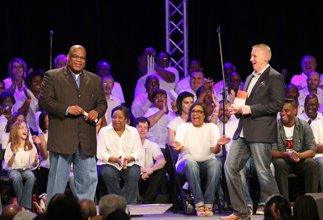 The Rev. Robert E. Fowler Sr., left, pastor of Victory Missionary Baptist Church, and the Rev. Vance Pitman, senior pastor of Hope Church, stand in front of members of their congregations who gath ...