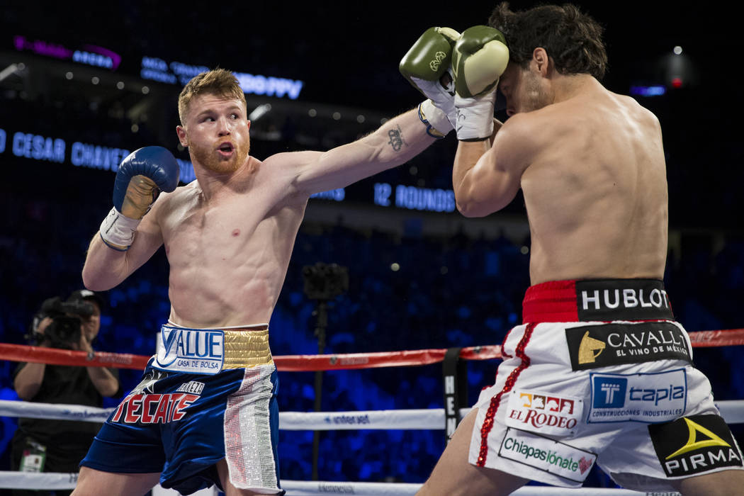 Saul Canelo Alvarez, left, battles Julio Cesar Chavez Jr. in the catch weight bout at T-Mobile Arena on Saturday, May 6, 2017, in Las Vegas. Alvarez won by unanimous decision. Erik Verduzco Las Ve ...