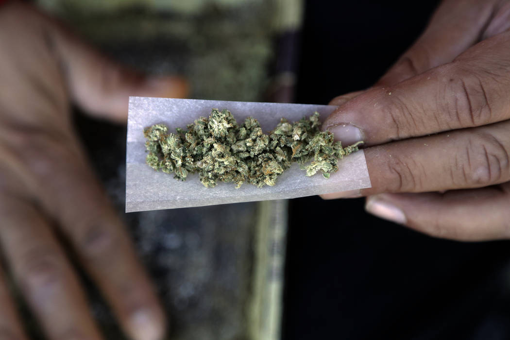 FILE - In this Wednesday, Nov. 9, 2016 file photo, a marijuana joint is rolled in San Francisco. Newly-approved laws in four states allowing the recreational use of marijuana are seen as unlikely  ...