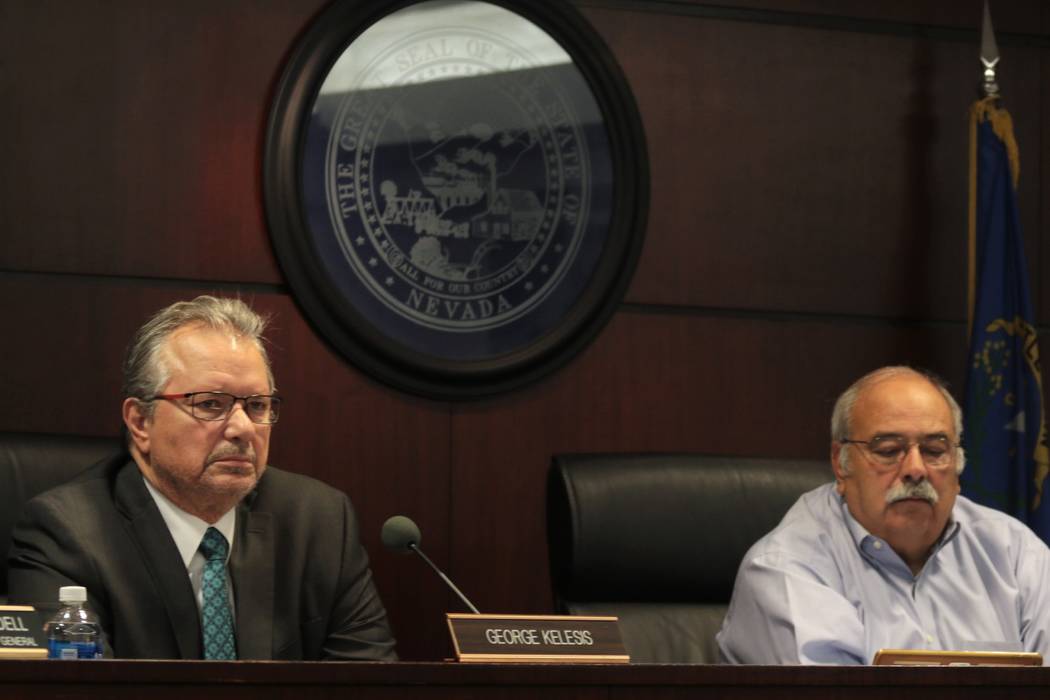 Nevada Tax Commission members George Kelesis, left, and Thom Sheets listen to a presentation on regulations for recreational marijuana sales in Las Vegas, Monday, May 8, 2017. The tax commission v ...