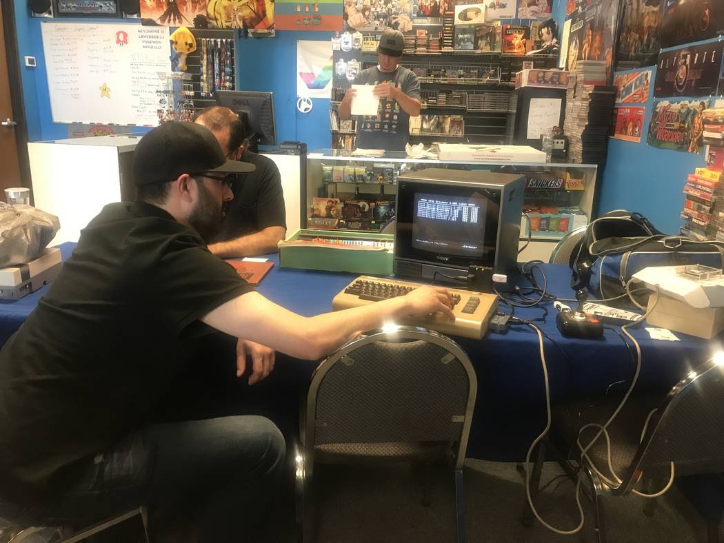 Saj Awan works on a Commodore 64 computer at a Clark County Commodore Computer Club meeting May 6 at Grand Line Games, 3281 N. Decatur Blvd. #240. (Kailyn Brown/View)