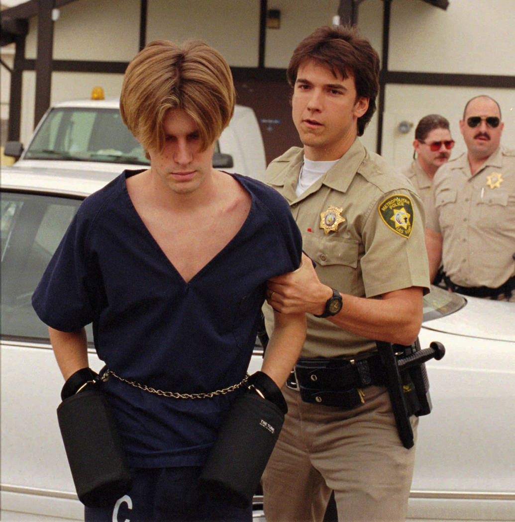 Jeremy Strohmeyer, left, charged with the kidnapping and murder of 7-year-old Sherrice Iverson in a casino in Primm, is taken into Goodsprings Justice Court by an officer on July 22, 1997, in Jean ...