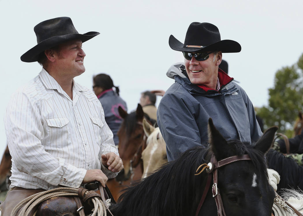 Rancher Kenny Black talks with Interior Secretary Ryan Zinke while on a horseback ride in the Bears Ears with local and state representatives in Blanding, Utah, Tuesday, May 9, 2017. Opponents and ...