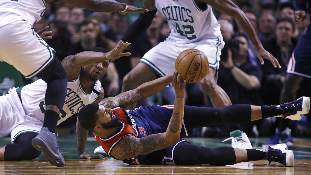 Washington Wizards forward Markieff Morris (5) looks to pass as he is surrounded by Boston Celtics players during the second quarter of Game 5 of an NBA basketball second-round playoff series, in ...