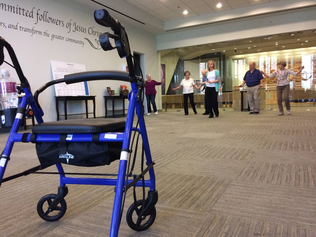 A walker sits unused as chair dancing takes place April 6, 2017, at Desert Spring United Methodist Church. 120 N. Pavilion Center Drive. The class, Dancing With Parkinson’s, seeks to make a brai ...