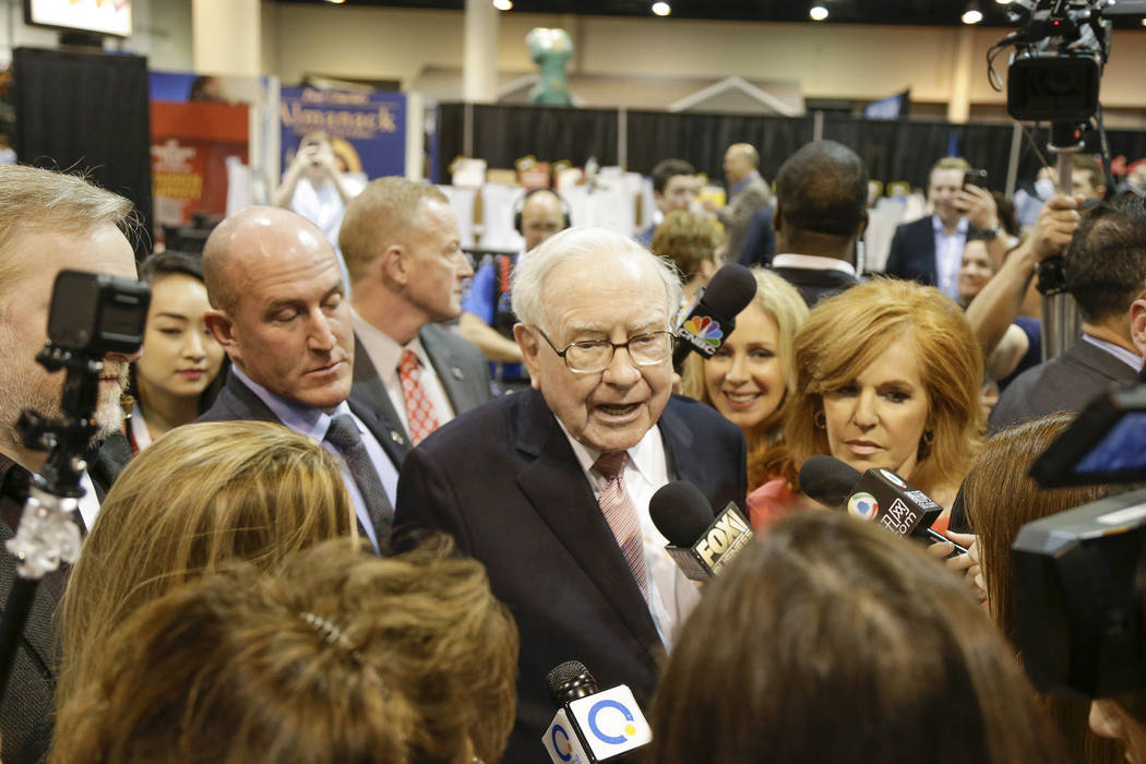 Warren Buffett, Berkshire Hathaway Chairman and CEO, talks to financial reporters. AP Photo/Nati Harnik