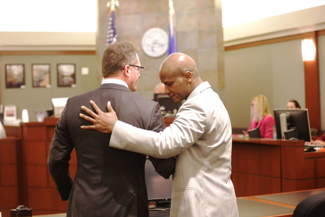 Defense attorney Robert Draskovich, left, hugs his client Frederick Richards, a former Bellagio club host who was just acquitted on all counts of kidnapping and two charges of sexual assault on Th ...
