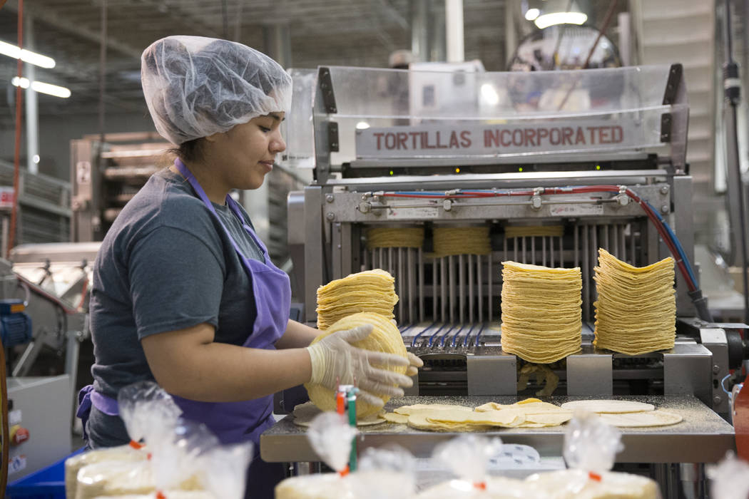 Sandra Castillas grabs a batch of tortillas before bagging them at the T.I. Foods warehouse on Tuesday, May 16, 2017, in North Las Vegas. Erik Verduzco Las Vegas Review-Journal @Erik_Verduzco