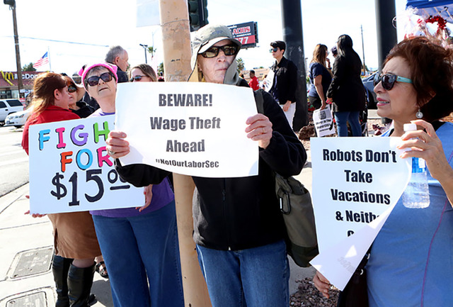 Residents and workers join a fighting for minimum wage protest outside a fast food restaurant in Las Vegas. (Bizuayehu Tesfaye/Special to the Pahrump Valley Times)