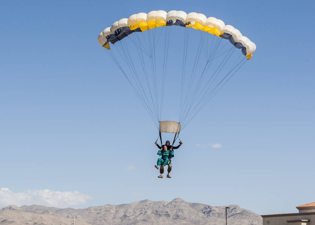 Jessica McCrane prepares to land with Vegas Extreme Skydiving instructor David Wessels at the Jean Sport Aviation Center in Jean on Tuesday, May 16, 2017. Patrick Connolly Las Vegas Review-Journal ...