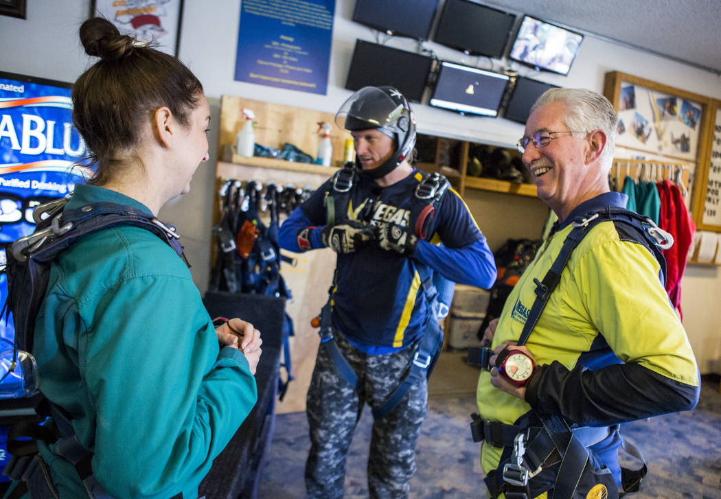 Bill McCrane, who just turned 60, shares a moment with his daughter, Jessica, before skydiving with Vegas Extreme Skydiving at the Jean Sport Aviation Center in Jean on Tuesday, May 16, 2017. Patr ...