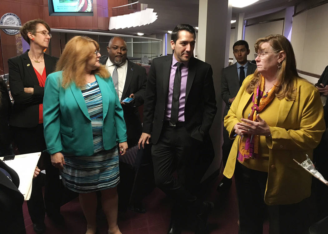 Members of the Assembly Ways and Means Committee, including Chairwoman Maggie Carlton, right, vote Monday, May 15, 2017, to introduce a bill to provide funding for legal counsel for the Gaming Con ...