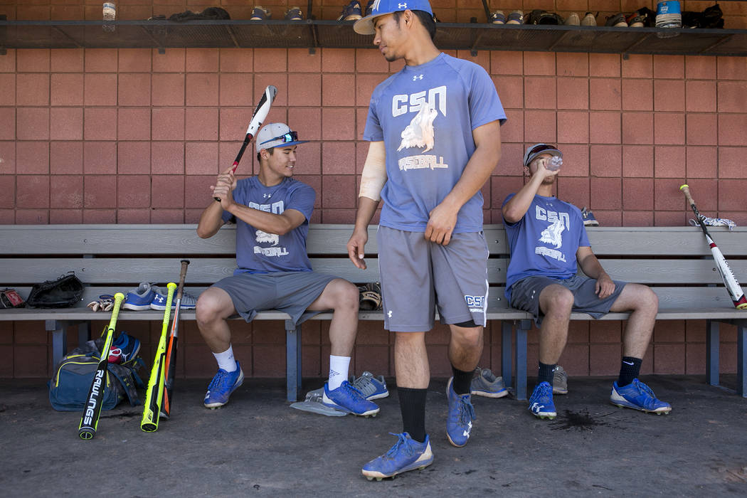 College of Southern Nevada baseball players Joey O'Brien, left, Jordan Macias, center, and Todd Danzeisen, right, gather in the dugout during a practice at Morse Stadium on Tuesday, May 16, 2017,  ...