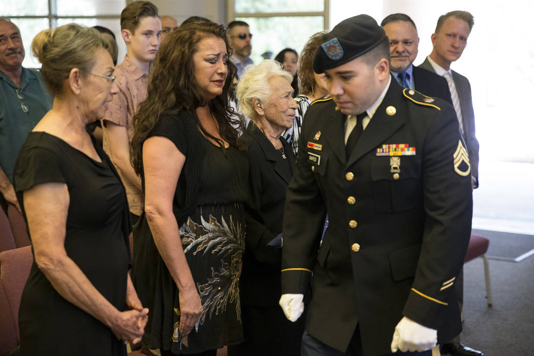 Korean War soldier Pfc. Manuel M. Quintana's great nephew U.S. Army National Guard Ssg. Nicholas Mapes after presenting the American flag to his great grandmother Mary Moreno, third from left, dur ...