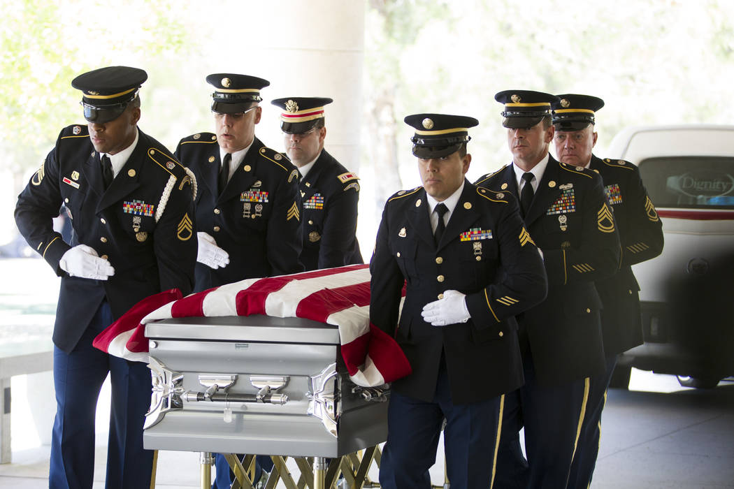 The Nevada National Guard Honor Guard moves the flag-draped casket with the remains of Korean War soldier Pfc. Manuel M. Quintana during his funeral at the Southern Nevada Veterans Memorial Cemete ...