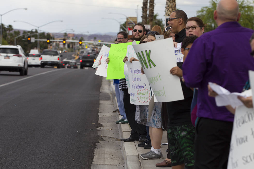 Teachers and supporters rally for affordable health insurance outside of the Clark County School District Education Center before a board meeting on Wednesday, May 17, 2017 in Las Vegas. Erik Verd ...