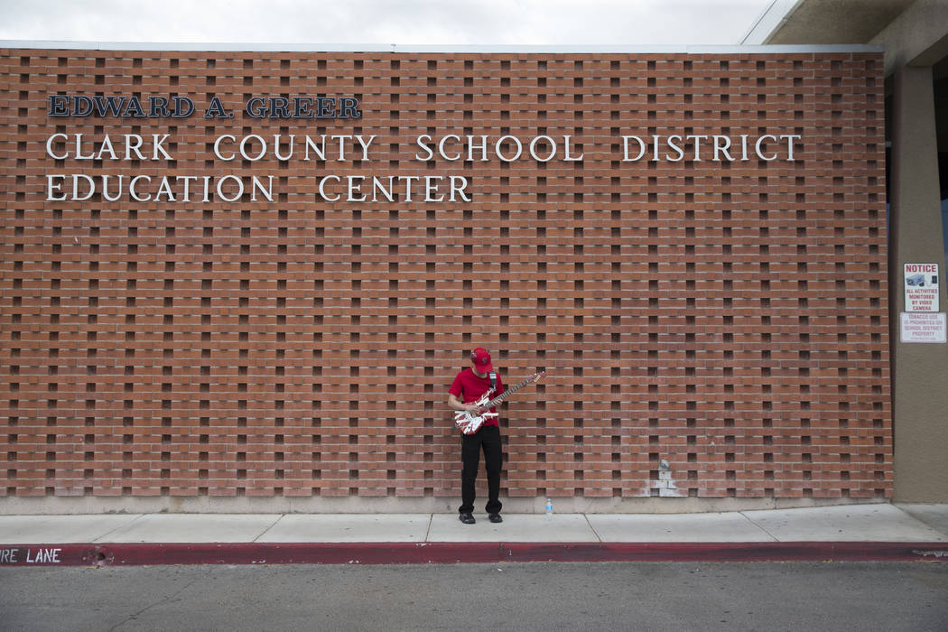 Clark High School teacher John Boland attends a rally for affordable health insurance with other teachers and supporters outside of the Clark County School District Education Center before a board ...