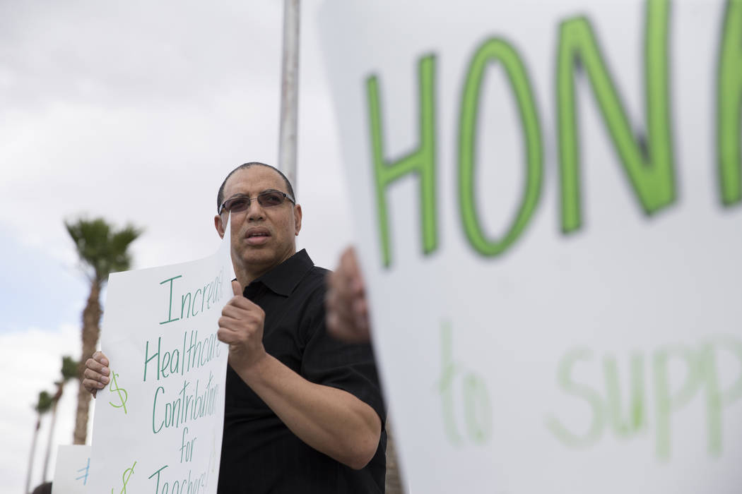 Teachers rally at CCSD board meeting for higher insurance