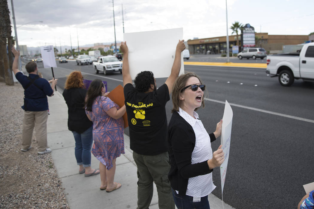 School psychologist Jordan Wenger attends a rally for affordable health insurance with teachers and supporters outside of the Clark County School District Education Center before a board meeting o ...