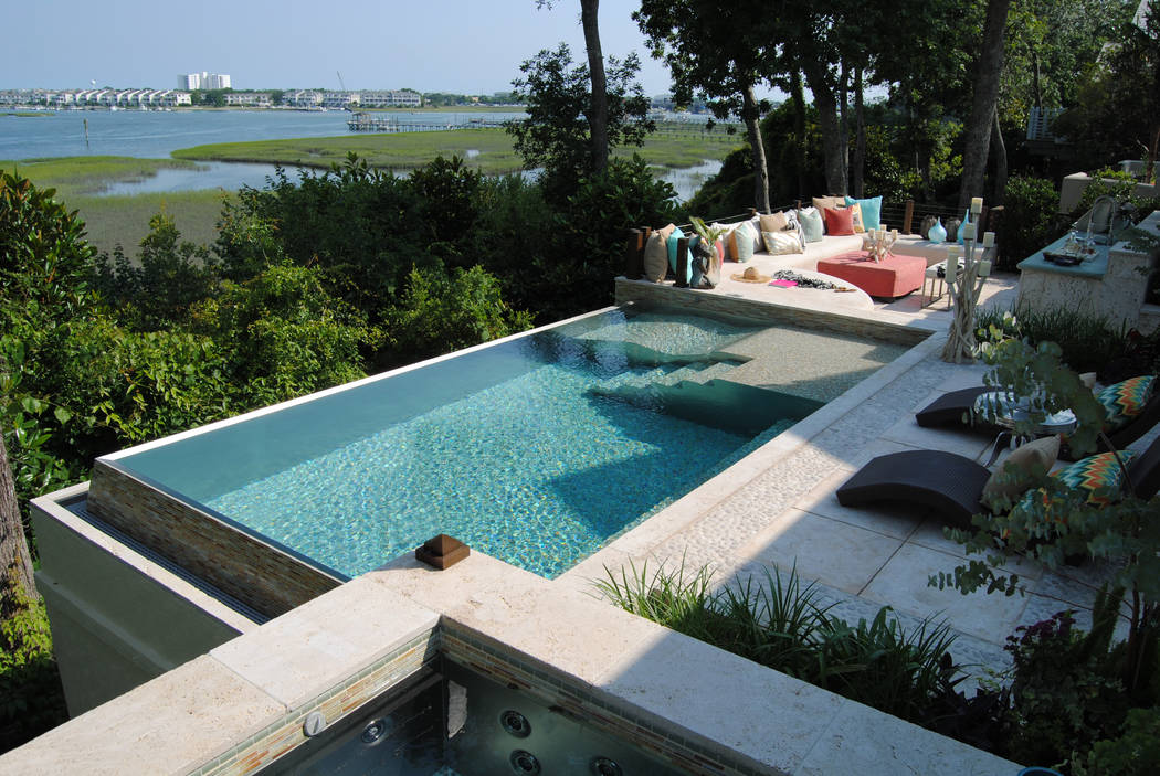 Bradford Products
A stainless steel pool and spa were installed on the second-floor deck of a private residence in Wilmington, North Carolina. The two-sided infinity edge pool features a Baja deck ...