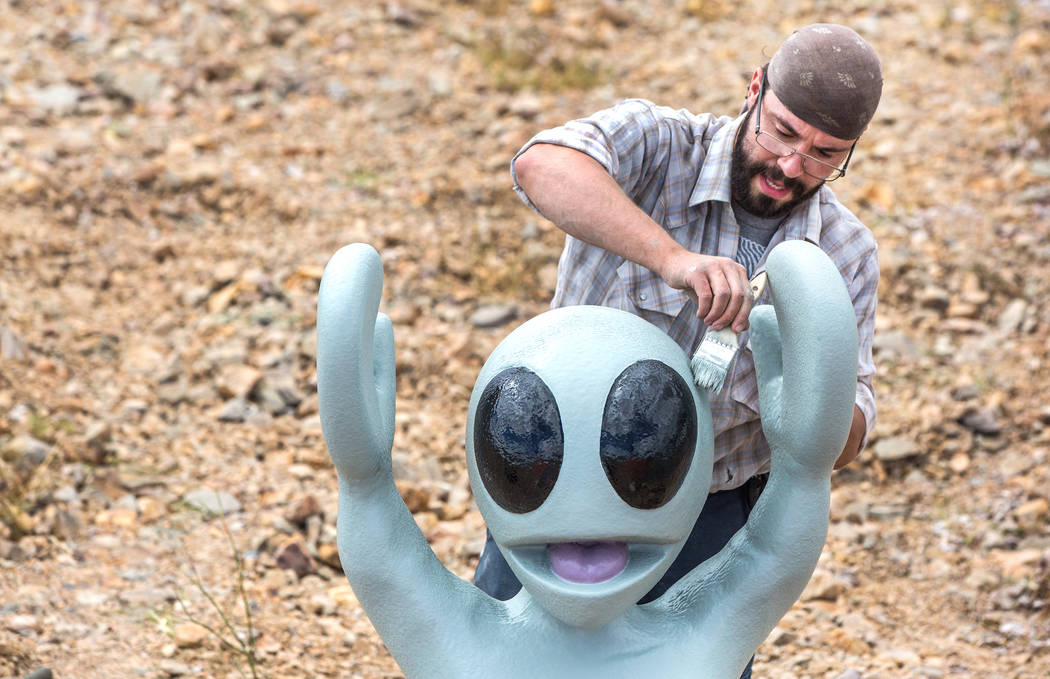 Artist Jesse Smigel works on the installation of his sculpture "I Told You Not to Paint It Hot Orange" on Thursday, May 18, 2017, in Las Vegas. Benjamin Hager Las Vegas Review-Jo ...