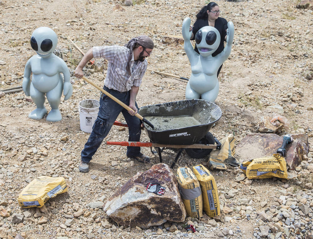 Artist Jesse Smigel, left, and Gia Ray work on the installation of Smigel's sculpture "I Told You Not to Paint It Hot Orange" on Thursday, May 18, 2017, in Las Vegas. Benjamin Hager Las Vegas Revi ...