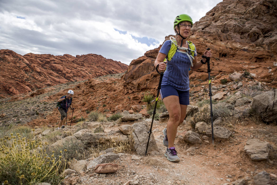 Candace Kawatsu hikes with her friend Rob Hays on the Kraft Mountain Loop trail in Calico Basin on Thursday, May 18, 2017. Patrick Connolly Las Vegas Review-Journal @PConnPie