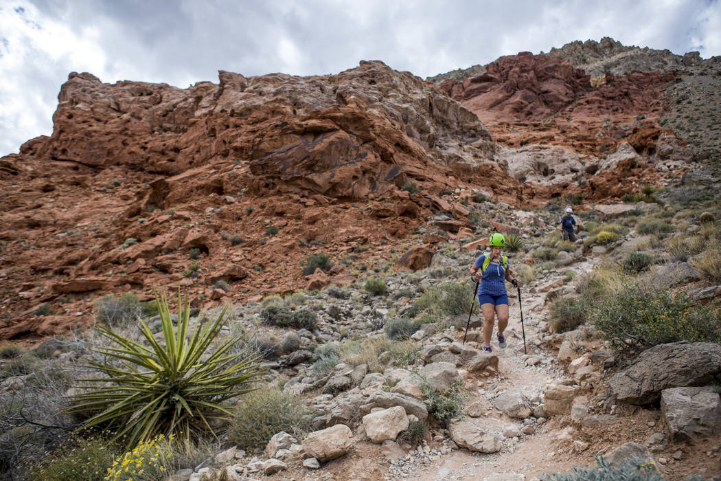 Candace Kawatsu hikes with her friend Rob Hays on the Kraft Mountain Loop trail in Calico Basin on Thursday, May 18, 2017. Patrick Connolly Las Vegas Review-Journal @PConnPie