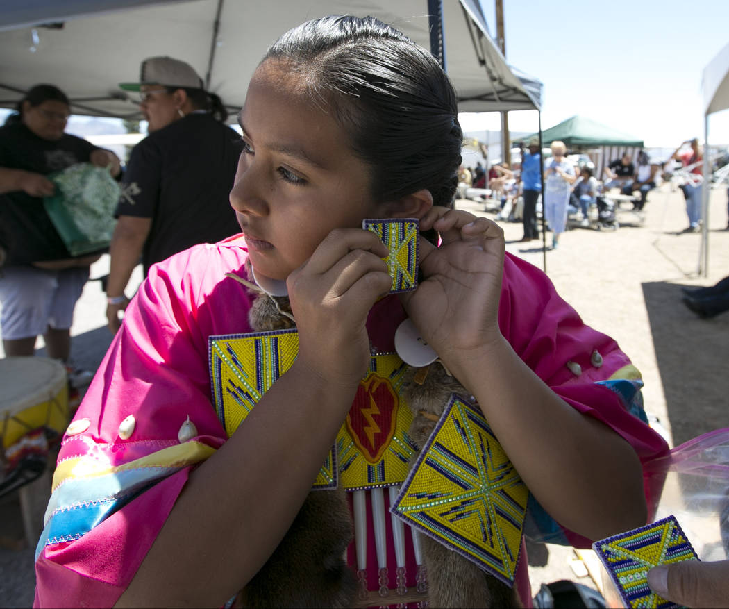 Echo Marie Hummingbird Jake puts on her earrings before participating in the grand entry ceremonies during the 28th annual Snow Mountain Pow Wow on Saturday, May 27, 2017. Richard Brian Las Vegas  ...