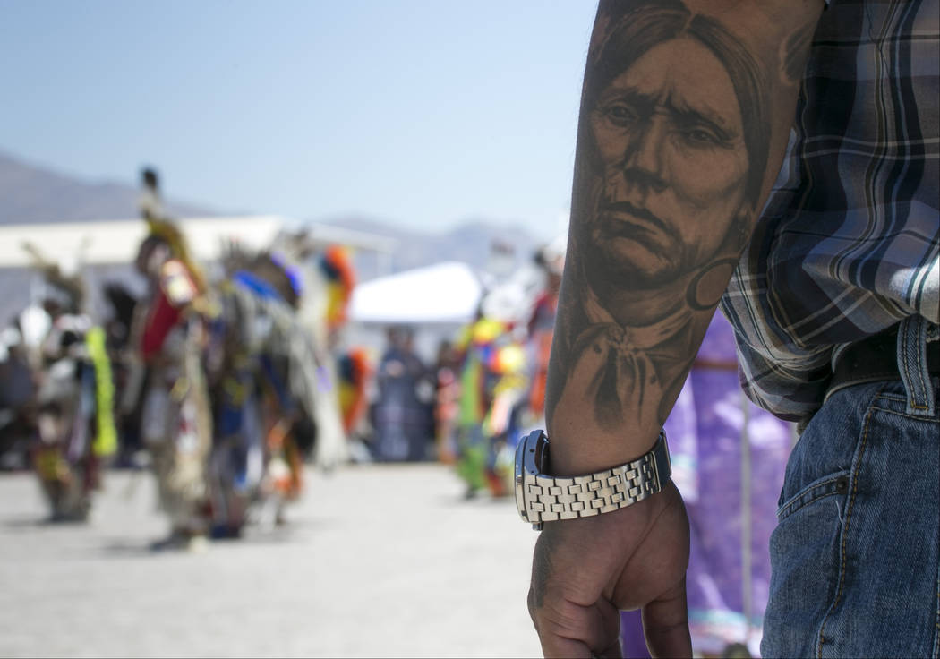 A spectator watches the grand entry ceremonies during the 28th annual Snow Mountain Pow Wow on Saturday, May 27, 2017. Richard Brian Las Vegas Review-Journal @vegasphotograph