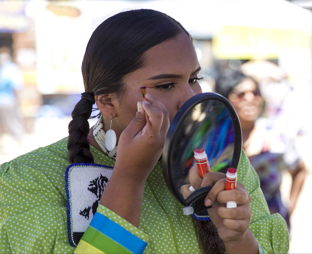 Wyomee Cooke, of Phoenix, Arizona, touches up her makeup before dancing in the grand entry ceremonies during the 28th annual Snow Mountain Pow Wow on Saturday, May 27, 2017. Richard Brian Las Vega ...