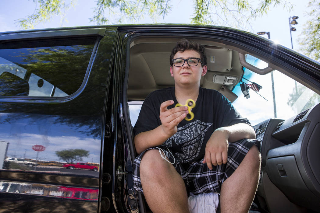 Anthony Murillo, 15, plays with his fidget spinner at Stephanie Lynn Craig Park in Henderson on Monday, May 22, 2017. Fidget spinners have been the source of scrutiny by some school teachers and o ...