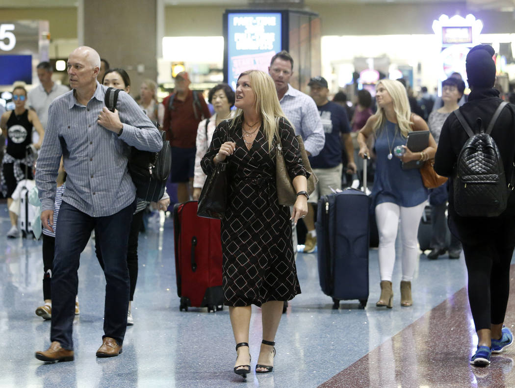 Passengers arrive at McCarran International Airport on Tuesday, May 23, 2017, in Las Vegas. Bizuayehu Tesfaye Las Vegas Review-Journal @bizutesfaye