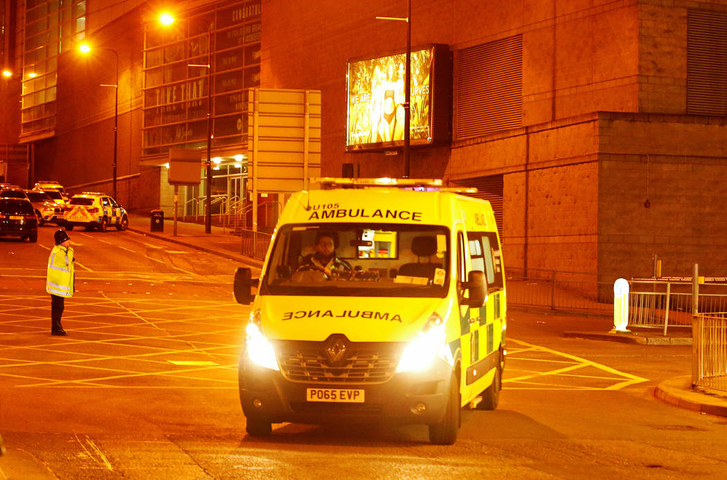 An ambulance drives away from the Manchester Arena, where U.S. singer Ariana Grande had been performing, in Manchester, northern England, Britain, May 23, 2017. (Reuters)