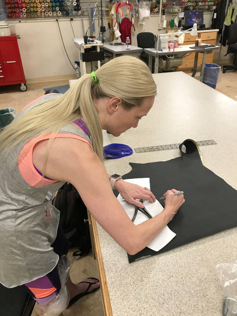 Brynn Coseru, a Cirque du Soleil synchronized swimmer, creates the hand fins she made as part of the requirements for her master's degree in occupational therapy degree at Touro University.
Photo ...