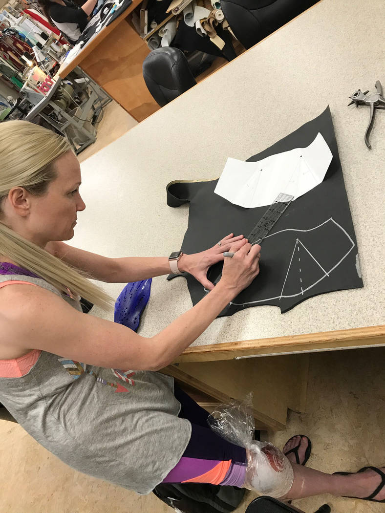 Brynn Coseru, a Cirque du Soleil synchronized swimmer, creates the hand fins she made as part of the requirements for her master's degree in occupational therapy degree at Touro University. 
Photo ...
